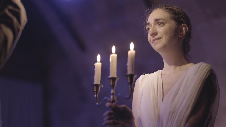 Girl holds candles